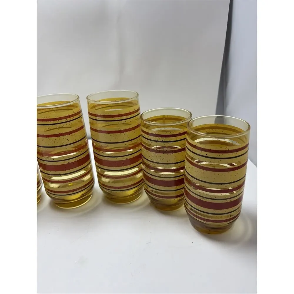 Mid Century Modern amber glass juice tumblers yellow red stripe speckled Anchor